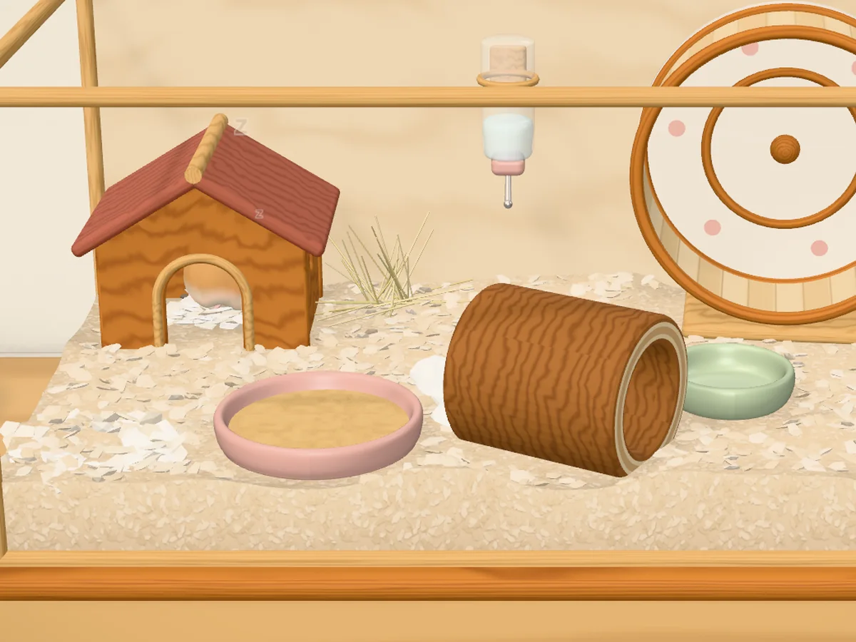 In-game, this morning, the same view: the tissue smaller and torn, the hamster asleep in its hut.
